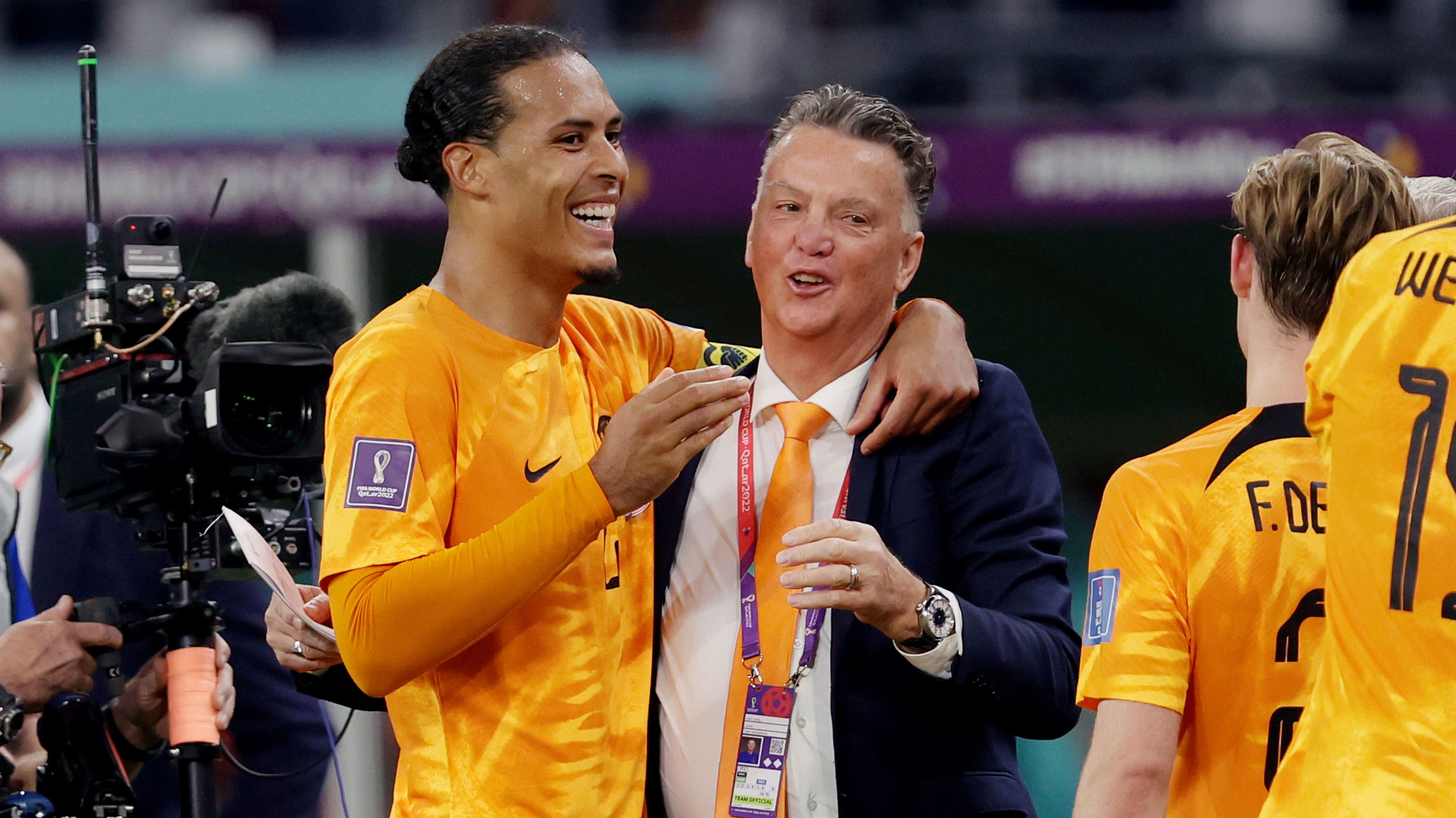 Virgil van Dijk with Netherlands coach Louis van Gaal, celebrating victory after their round of 16 World Cup clash with Qatar.