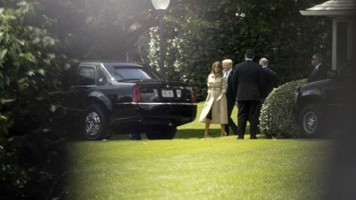 Melania and Donald Trump in her first sighting in nearly a month. Picture: AP