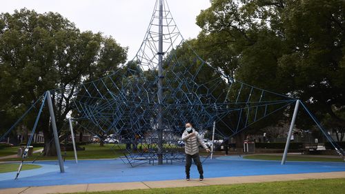 A man practices Tai chi in Campsie as COVID-19 cases spill into the area.