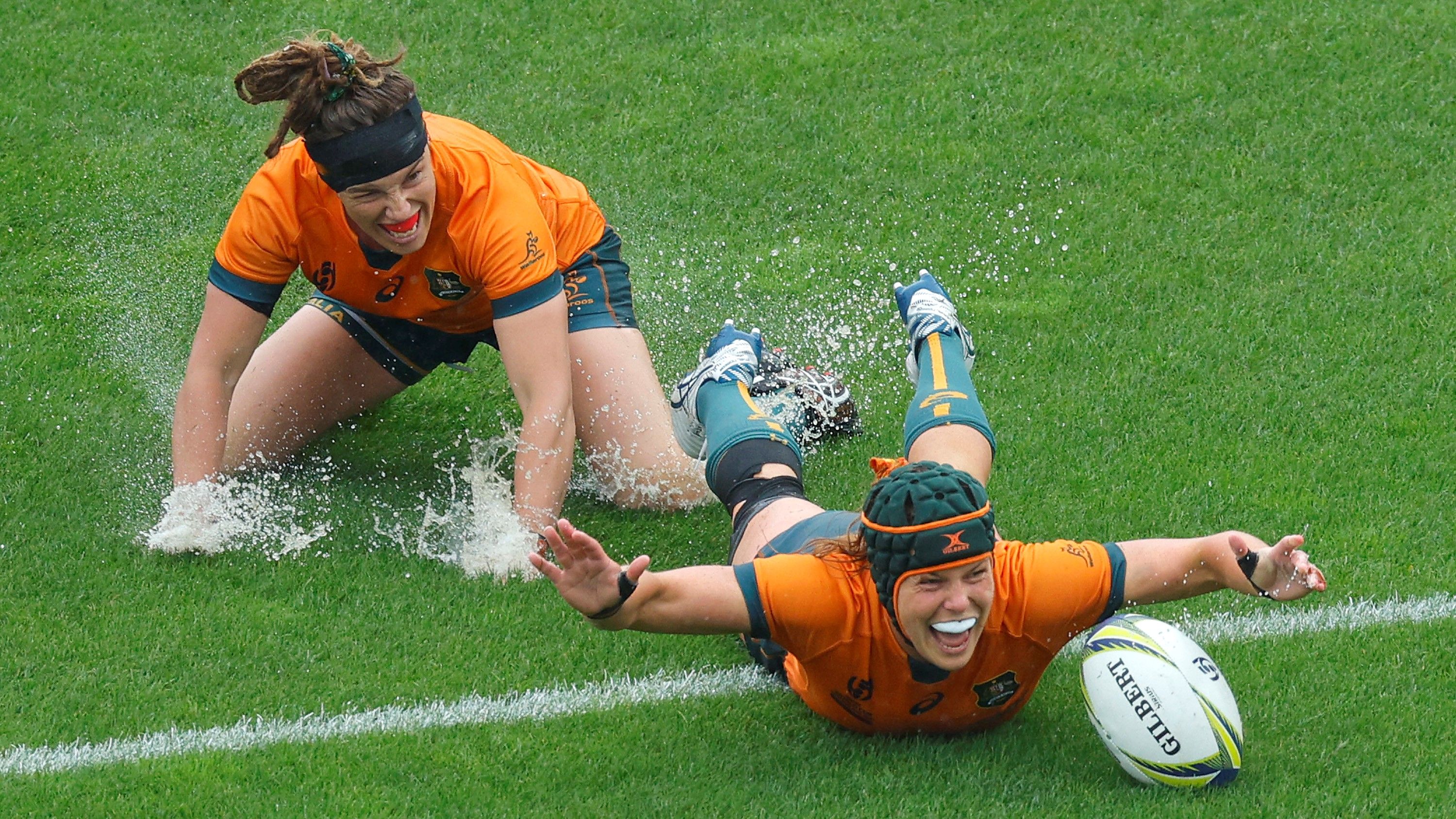 Emily Chancellor (right) celebrates scoring a try during the Rugby World Cup quarter-final match between England and Australia at Waitakere Stadium.