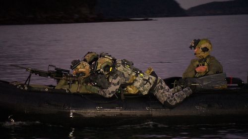 They keep a low profile against a possible enemy radar. From that position the divers can simply roll into the water. (9NEWS)