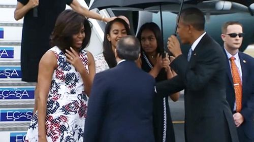 President Obama, First Lady Michelle and daughters Malia and Sasha arriving in Havana.