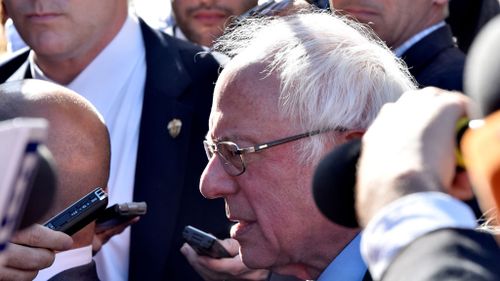 US presidential candidate Bernie Sanders mobbed by media in Rome