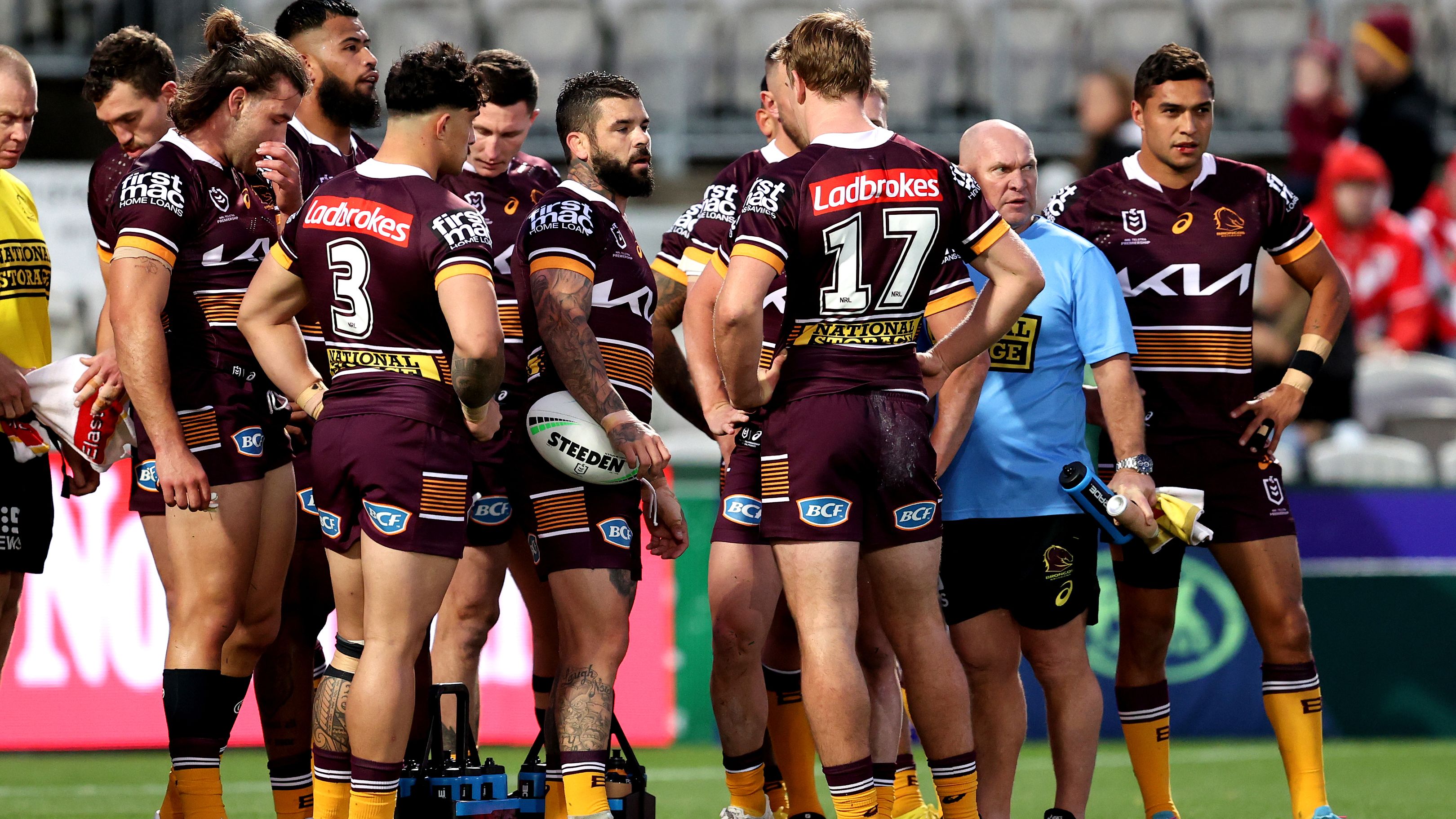 Broncos players react during their game against the Dragons.