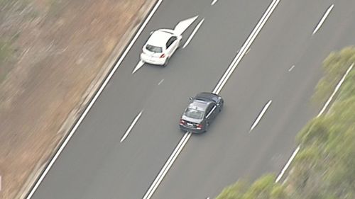 The BMW driver has been spotted darting in and out of lanes numerous times. (9NEWS)