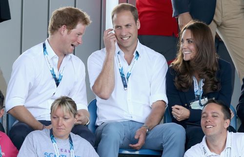 Prince Harry, Prince William and Catherine, Duchess of Cambridge, sit in the stands during events at the Glasgow Commonwealth Games.