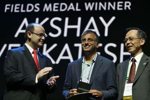 A handout photo made available by Brazil Agency shows shows Princeton University and Standford University's professor Akshay Venkatesh (C) as he receives the Fields medal during the awarding ceremony, in Rio de Janeiro, Brazil, 01 August 2018. Four scientists received the Fields Medal, the most important prize in the mathematical world, known as the 'Nobel' of this discipline. The four winners, an Indian, an Italian, an Iranian and a German, received the highest award of mathematics during the International Mathematics Congress (ICM 2018), which this year and for the first time, is held in Brazil. EPA/Tania Rego