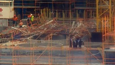 Scaffolding on the site collapsed under extra weight.