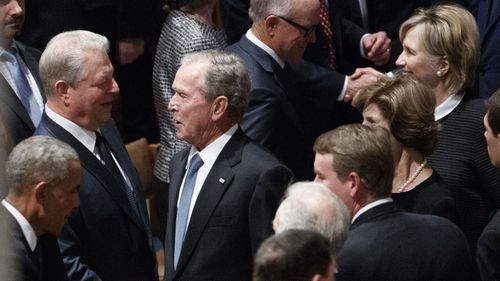 George W Bush chatting to Al Gore