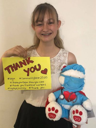 Hayley with bear and thank you sign