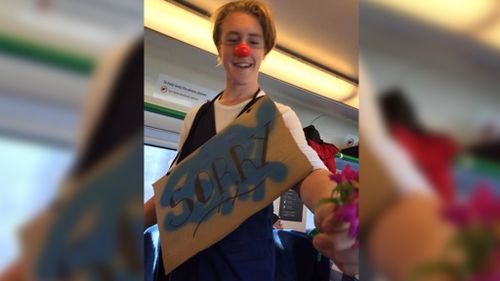 Creepy clown puts on a happy face and makes amends with Melbourne train passengers