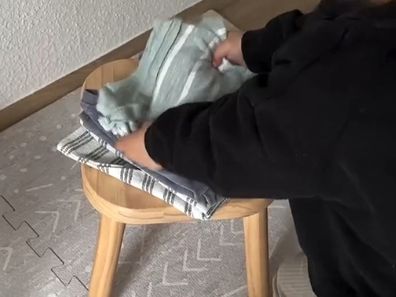 Mum shares simple hack to get her toddler to help fold laundry