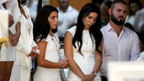 Leila Geagea (middle) and daughter (left) are seen during the funeral for her children Antony Abdallah, 13, Angelina Abdallah, 12, and Sienna Abdallah, 8, at Our Lady of Lebanon Co-Cathedral in Sydney, Monday, February 10, 2020.