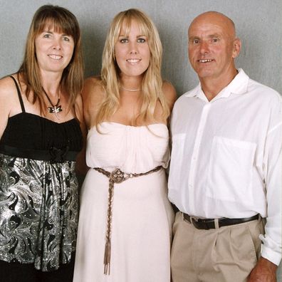 Jessica Loch with her proud parents at her year 12 formal