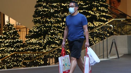 Shoppers in Sydney on Christmas Eve