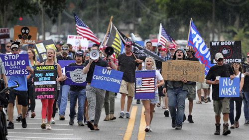 Protesters in Sanford, Florida demonstrating against a rule mandating the wearing of masks. 