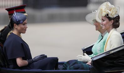 Britain's Camilla, the Duchess of Cornwall, far right, Kate, the Duchess of Cambridge, right, Prince Harry, rear left, and Meghan, the Duchess of Sussex ride in a carriage to attend the annual Trooping the Colour Ceremony in London, Saturday, June 8, 2019. (AP Photo/Frank Augstein)