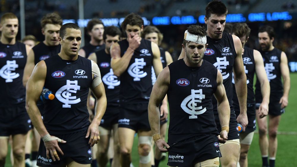 Carlton captain Marc Murphy leads his players off the field after a loss to Hawthorn in 2015. (AAP)