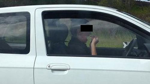 Woman caught flossing while driving at 100km/h on Gold Coast motorway