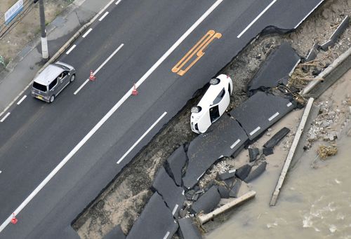 Parts of a major highway in Hiroshima have collapsed in a landslide. Picture: AP