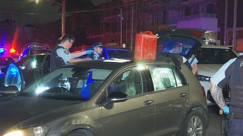 Multiple items were seized from the vehicle, including jerrycans and a baseball bat. 