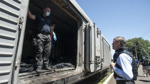 Long journey home: Body-filled train departs station after rebels reach agreement