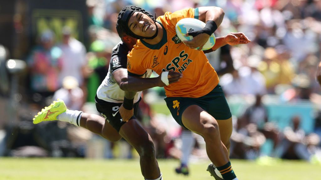 Dietrich Roache of Australia is tackled at HBF Park.