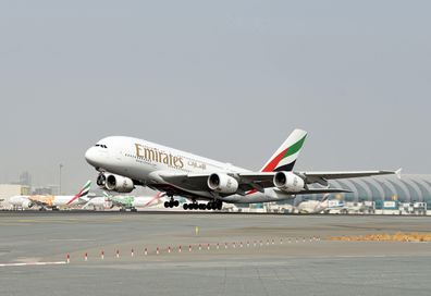 Emirates passenger jet takes off.