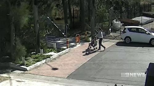 CCTV of the incident show the girl's mother pushing her through the park in a stroller.