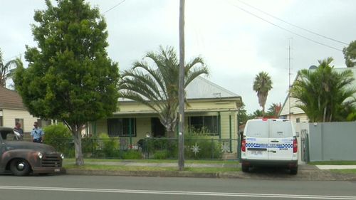 A man has been arrested and is assisting police after the body of a 76-year-old woman was found in the yard of a home near Wollongong, south of Sydney.