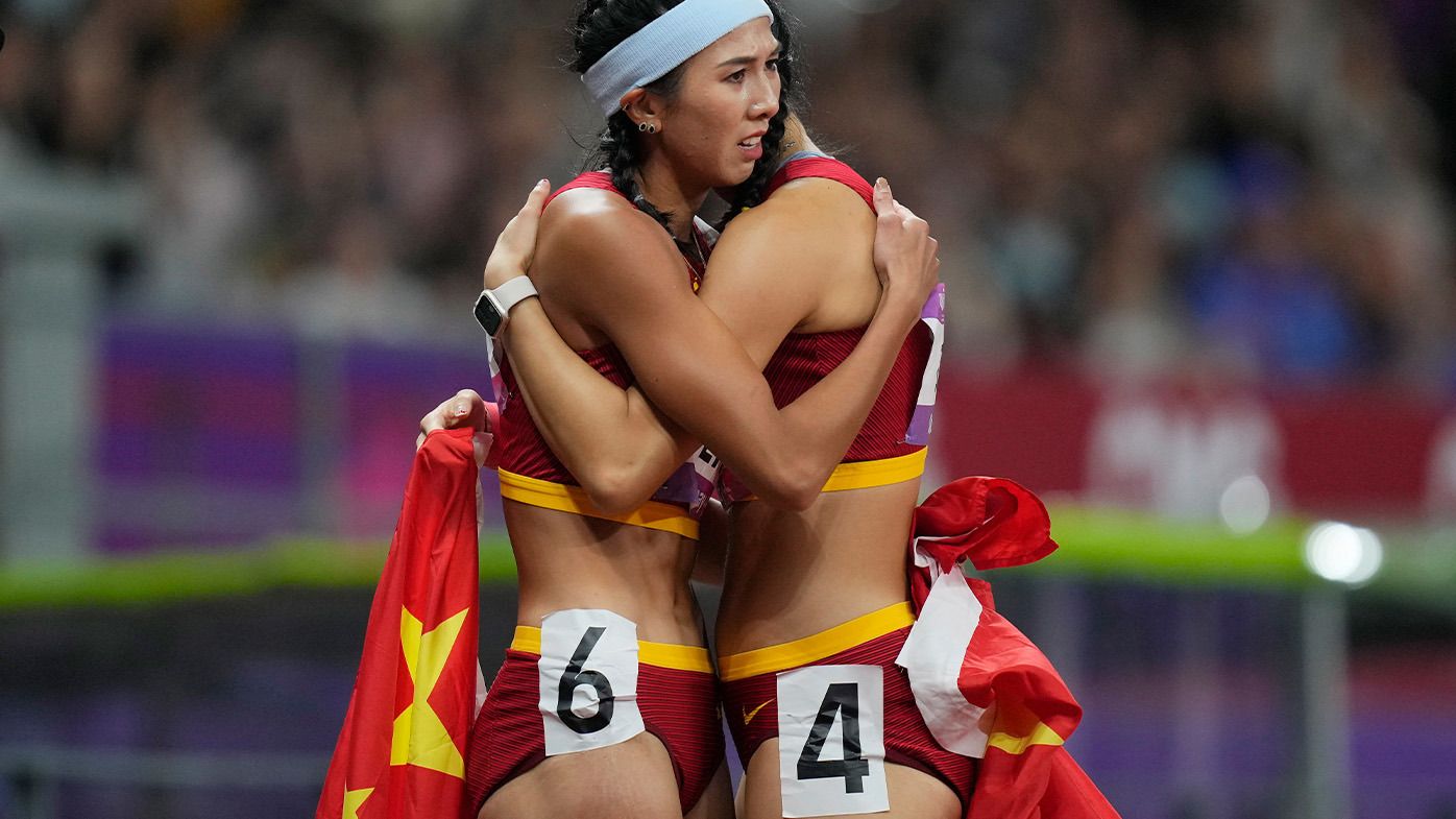 China&#x27;s Lin Yuwei, left, hugs compatriot Wu Yanni at the 2023 Asian Games.
