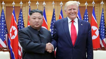 In this Sunday, June 30, 2019, photo provided by the North Korean government, North Korean leader Kim Jong Un, left, and U.S. President Donald Trump shake hands inside the Freedom House on the southern side of Panmunjom, South Korea.