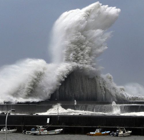 High waves hit breakwaters at a port of Aki.