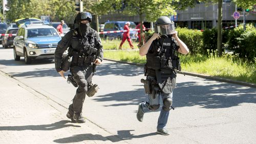 Heavily-armed police outside a movie theatre complex where an armed man has reportedly opened fire in Viernheim, Germany. (Getty)