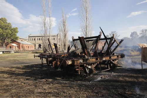 Fire smoulders on an old burnt-out coal wagon at Richmond Vale Railway Museum. (AAP)