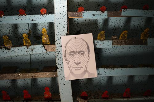 A picture of Russian President Vladimir Putin hangs at a target practice range in Lviv, Ukraine, March 17, 2022 