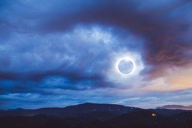 The Totality Solar Eclipse a double exposed image shot with the Blue Ridge Mountains in North Carolina.