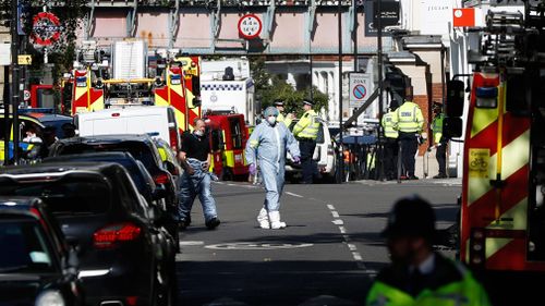 Forensic teams outside the tube station. (AAP)