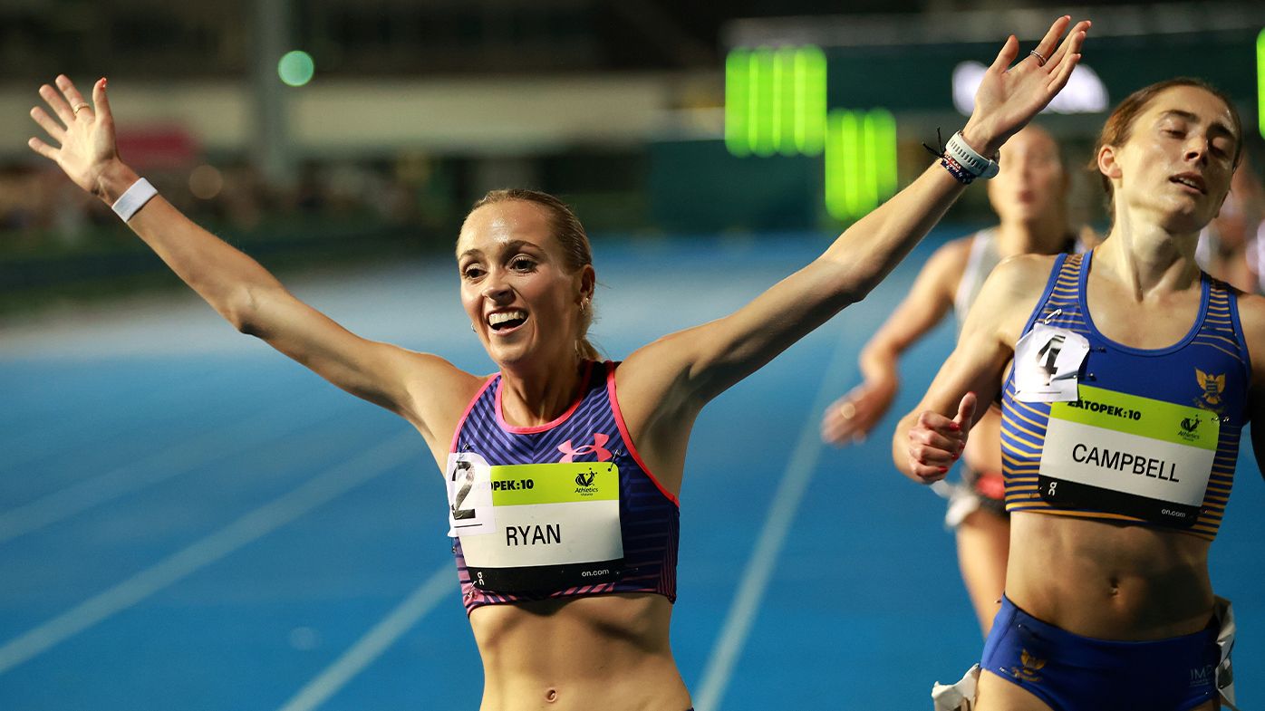 Lauren Ryan celebrates victory her Australian women&#x27;s 10,000m title victory in Melbourne.