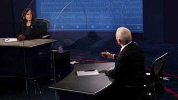 Democratic vice presidential candidate Sen. Kamala Harris, D-Calif., listens as Vice President Mike Pence answers a question during the vice presidential debate.