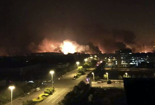 Smoke and fire erupted into the night sky following the explosion. (AAP)