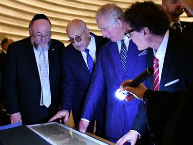 The Prince of Wales hears about the Shrine of the Book exhibition which houses the Dead Sea Scrolls, the world's oldest biblical manuscripts. HRH had the opportunity to view the scrolls inside the Shrine of the Book.