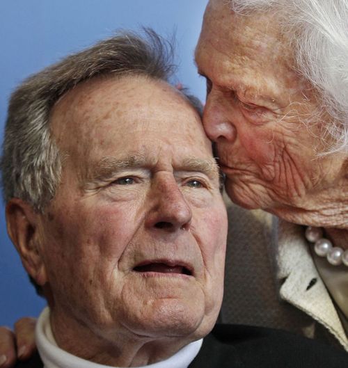 Former President George H.W. Bush, and his wife, former first lady Barbara Bush, arrive for the premiere of HBO's new documentary on his life near the family compound in Kennebunkport, Maine in 2012 Bush has died at age 94. 