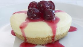 Vanilla cheesecakes with cranberry syrup