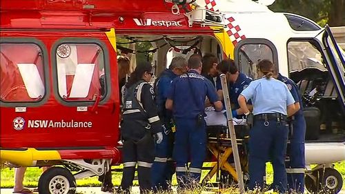 A five-year-old girl has been rushed to hospital after being trapped in a car.
