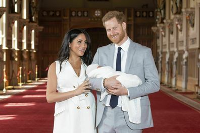 FILE - In this Wednesday May 8, 2019 file photo Britain's Prince Harry and Meghan, Duchess of Sussex, pose during a photocall with their newborn son Archie, in St George's Hall at Windsor Castle, Windsor, south England. The Duchess of Sussex has revealed that she had a miscarriage in July. Meghan described the experience in an opinion piece in the New York Times on Wednesday. She wrote: "I knew, as I clutched my firstborn child, that I was losing my second." The former Meghan Markle and husband 