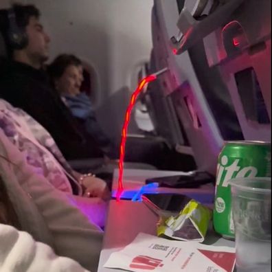 Passenger's obnoxious light-up charger on flight draws ire