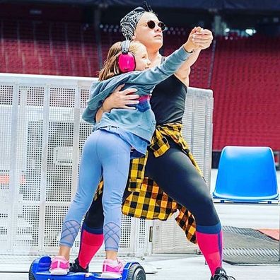 Pink poses with her daughter Willow during her tour.