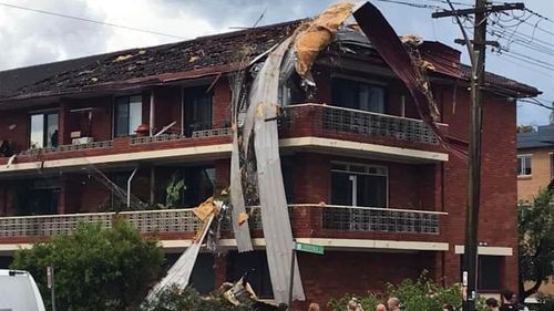 The storm ripped roofs off buildings.