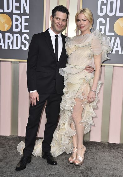 Thomas Kail, left, and Michelle Williams arrive at the 80th annual Golden Globe Awards at the Beverly Hilton Hotel on Tuesday, Jan. 10, 2023